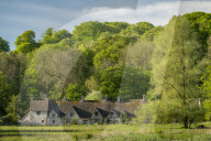 Arlington Row cottages in the pretty Cotswolds village of Bibury, Gloucestershire, England. Spring (May) 2019.