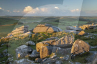 First light on the granite boulders of Roughtor in Bodmin Moor, Cornwall, England. Summer (June) 2019.