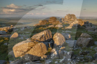 First light on the granite boulders of Roughtor in Bodmin Moor, Cornwall, England. Summer (June) 2019.