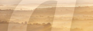 Mist covered rolling countryside at dawn, Dartmoor, Devon, England. Winter (March) 2016.