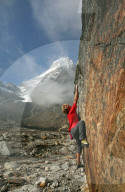 Climber bouldering at Tangnag moraine, Khumbu