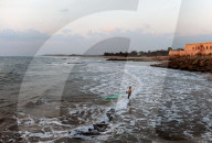 Fisherman fishing with a net in the early morning in the waters of the Bay of Bengal, Tranquebar, Tamil Nadu