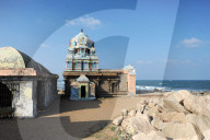 Weatherbeaten Hindu temple to Ganesh on the rocky coast at Tranquebar, Tamil Nadu