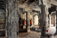 Two dressed deities at shrine inside pillared hall in 11th century Gangaikonda Cholapuram temple, Ariyalur district, Tamil Nadu