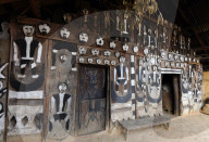 Traditional Naga village house front, decorated with tribal head-hunting icons, Mao Maram, Manipur