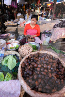 Woman selling nutmeg and other spices in Ima women‚Äôs market, Imphal, Manipur