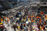 Early morning trading of marigold garland ropes, Malik Ghat flower market, Kolkata, West Bengal