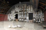 Naga chief‚Äôs house, heavily decorated with tribal headhunting images, Nagaland