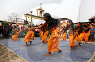 Assamese village women in Assam state dress, performing knife dance in front of villagers, Sualkuchi district, Assam