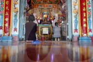 Mieu Ba Ngu Hanh buddhist temple. Women praying. Women praying. Vung Tau. Vietnam.