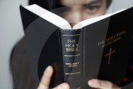 Christian woman reading the Holy Bible.