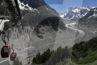 Mont Blanc massif. The Mer De Glace glacier which has thinned 150 meters since 1820. Gondola lift. France.