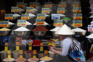 Vietnamese woman at market. Dry food Stall. Ho Chi Minh City. Vietnam.