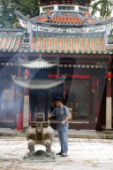 Thian Hock Keng Temple. Buddhist Worshipper. Burning incense sticks. Singapore.