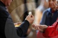 Roman catholic mass. Holy communion. Saint-Nicolas de Veroce church. France.
