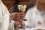 Roman catholic mass. Eucharist celebration. Saint-Nicolas de Veroce church. France.