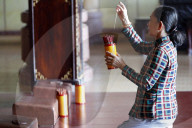 Woman at temple. Buddhist divination. Pho Da temple. Vung Tau. Vietnam.