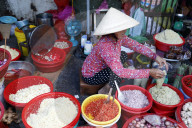 Vietnamese woman working at market. Ho Chi Minh city. Vietnam.