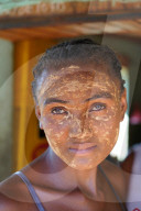 Girl with masonjoany a beauty mask obtained using the powder from the sandalwood of Madagascar shrub, Miandrivazo, Madagascar
