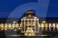 Illuminated fountain,at dusk, on the Bowling Green, in front of the Kurhaus, in Wiesbaden, Hesse, Germany