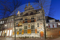 The Gemeenlandshuism, a historic building on the Oude Delft canal in Delft, the Netherlands.