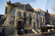 Historic facade of the butcher's hall, now De Centrale, on Voldergracht in Delft, the Netherlands.