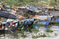 Muslim Cham fishing people that live on their boats; dwindling fish stocks have caused poverty. R Mekong, Phnom Penh, Cambodia