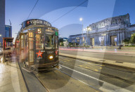 City tram outside of Milan Central Station at dusk, Milan, Lombardy, Italy, Europe