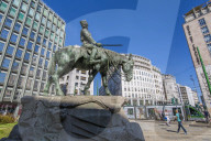 City tram and statue in Piazza Giuseppe Missori, Milan, Lombardy, Italy, Europe