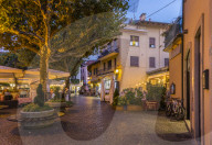 View of restaurants and souvenir shops in Stresa at dusk, Lago Maggiore, Piedmont, Italy, Europe