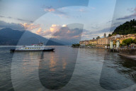 View of Lake Como and ferry arriving at Bellagio at sunset, Province of Como, Lake Como, Lombardy, Italy, Europe