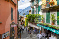 View of shops on cobbled street in Bellagio, Province of Como, Lake Como, Lombardy, Italy, Europe