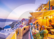 View of restaurant in Oia village overlooking the sea at dusk, Santorini, Aegean Island, Cyclades Island, Greek Islands, Greece, Europe