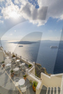 View of Fira restaurant and cruise ship, Firostefani, Santorini (Thira), Cyclades Islands, Greek Islands, Greece, Europe