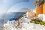 View of blue domed church from cafe in Oia village, Santorini, Aegean Island, Cyclades Island, Greek Islands, Greece, Europe