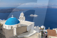 Blue dome and belltower of the church of St. Gerasimos, Firostefani, Fira, Santorini, Cyclades, Greek Islands, Greece, Europe