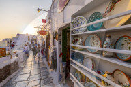 Shops selling souvenirs at Oia at sunset, Santorini, Greek Islands, Greece, Europe