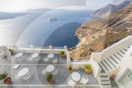 View of Fira white washed houses, harbour and cruise ship, Firostefani, Santorini (Thira), Cyclades Islands, Greek Islands, Greece, Europe
