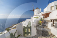 View of windmill overlooking Oia village, Santorini, Aegean Island, Cyclades Island, Greek Islands, Greece, Europe