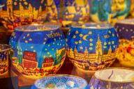 Christmas decorations on Christmas market stall at night in Rathausplaza, Vienna, Austria, Europe