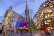 View of St Stephans Cathedral, shops and Christmas tree on Stephanplatz at dusk, Vienna, Austria, Europe