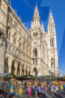View of Rathaus and Christmas market stalls in Rathausplatz, Vienna, Austria, Europe