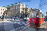 View of Royal Opera House and city tram on Opernring, Vienna, Austria, Europe