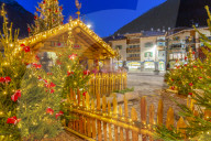View of Nativity and Christmas tree in Moena town centre at dusk, Province of Trento, South Tyrol, Italy, Europe