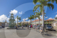 View of cyclists in The Circus and Memorial Clock, Basseterre, St Kitts & Nevis, West Indies, Caribben, Central America