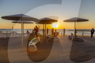 View of sunshades on promenade at sunset, Hayarkon Street, Tel Aviv, Israel, Middle East