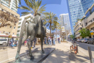 View of statue, palm trees and walkway on Rothschild Boulevard, Tel Aviv, Israel, Middle East