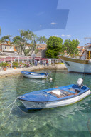 View of harbourside restaurants in Cavtat on the Adriatic Sea, Cavtat, Dubronick Riviera, Croatia, Europe