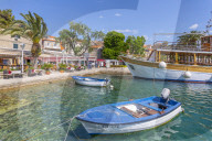View of harbourside restaurants in Cavtat on the Adriatic Sea, Cavtat, Dubronick Riviera, Croatia, Europe
