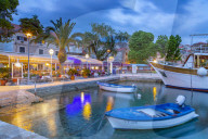 View of restaurants and harbour boats at dusk, Cavtat on the Adriatic Sea, Cavtat, Dubronick Riviera, Croatia, Europe